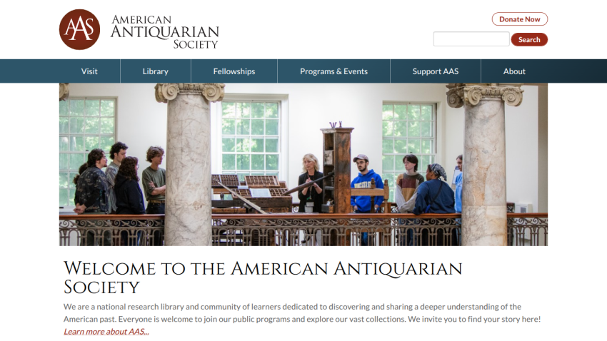 American Antiquarian Society homepage with navigation menu, hero image of people in a library, and welcome message about research and public programs.