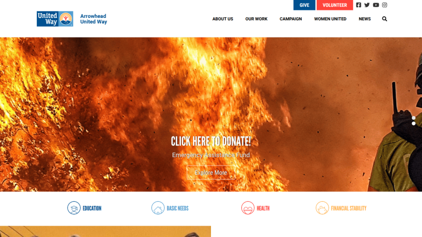 Homepage with navigation bar, large hero image of a mountain landscape, and headline 'Explore the World Outdoors'