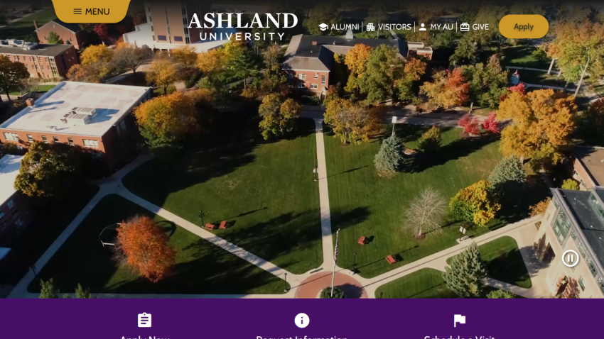 Aerial view of Ashland University's campus with trees and pathways.