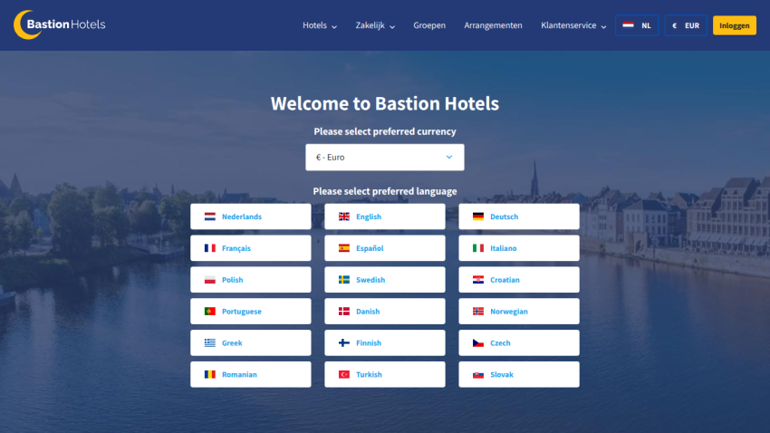 Bastion Hotels homepage with currency dropdown and language selection options over a cityscape background