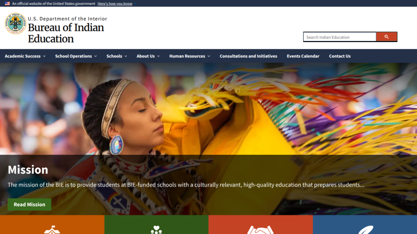 Bureau of Indian Education homepage with mission statement and navigation menu, featuring a Native American dancer in colorful attire.