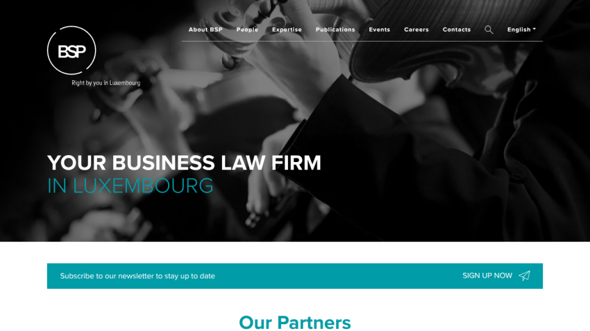 Business law firm website showcasing services in Luxembourg with partner section.