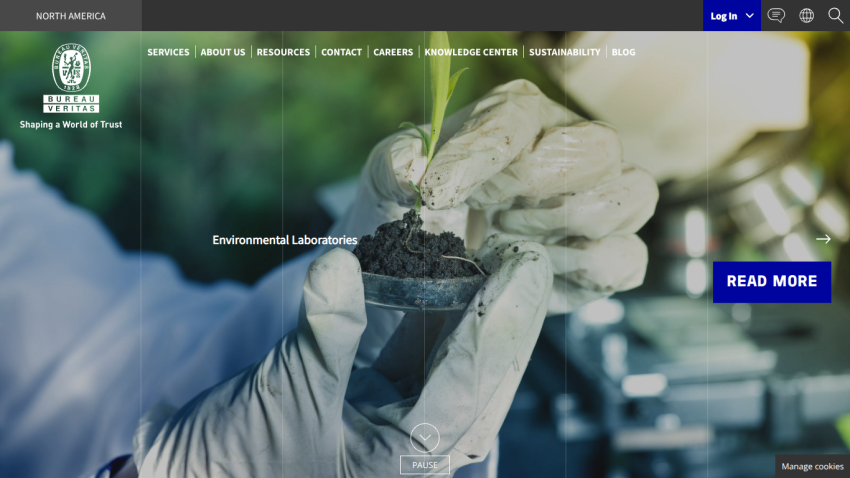 Bureau Veritas North America website with navigation and hero image of gloved hands holding a plant seedling in soil