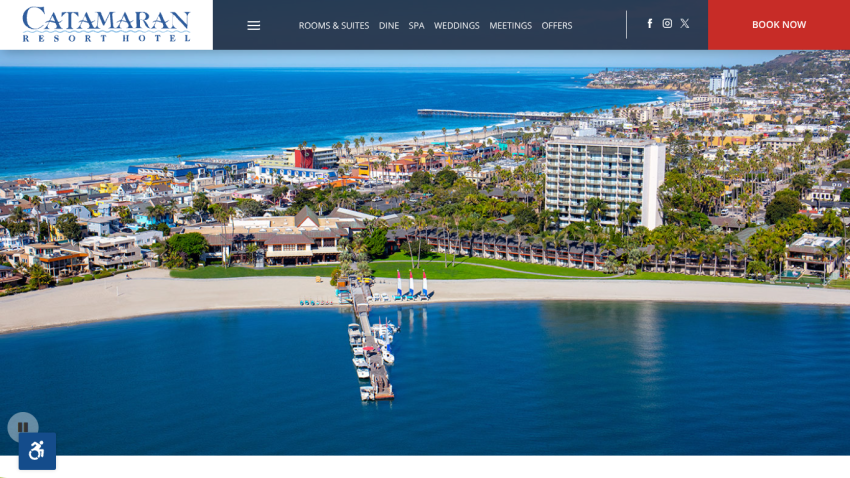 Catamaran Resort Hotel website header with navigation and aerial view of beachfront hotel and marina
