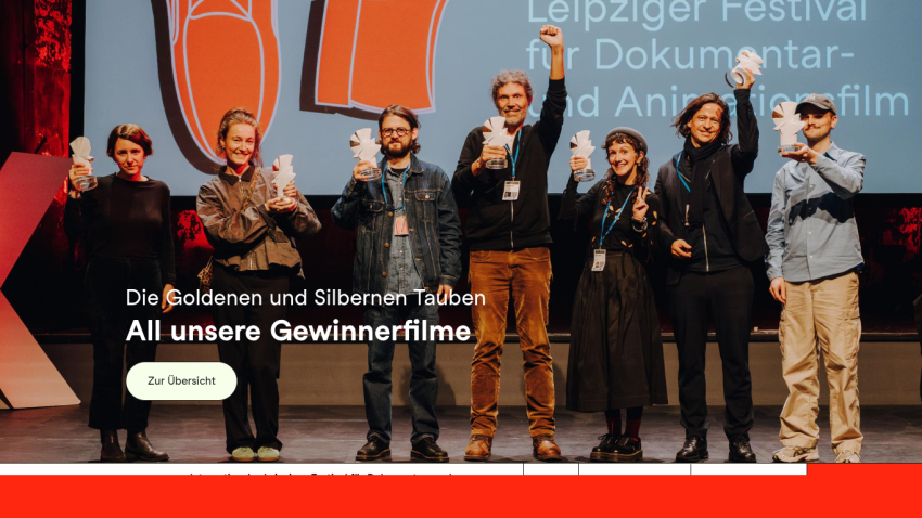 Group of people on stage celebrating at Leipzig Festival for Documentary and Animated Film with headline and button