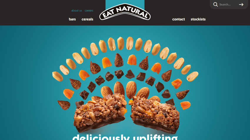 Eat Natural website header with navigation and a granola bar with ingredients on a red background