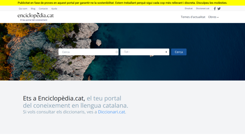 Encyclopedia homepage with search bar over a coastal cliff background and Catalan language text