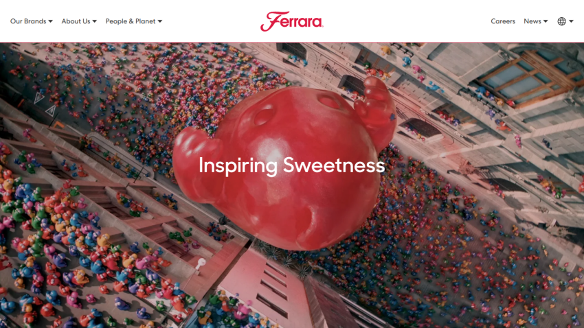Ferrara website with aerial view of a large red balloon and crowd, text Inspiring Sweetness.
