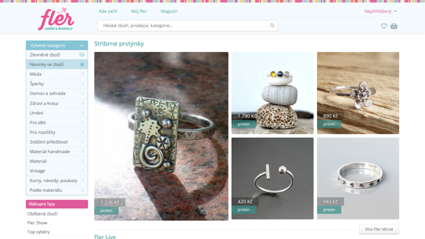 Jewelry website showcasing various rings and accessories in a grid layout.