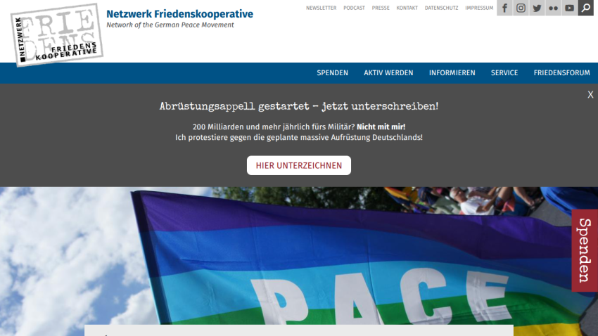 Network Friedenskooperative website with peace flag image and call to sign disarmament appeal