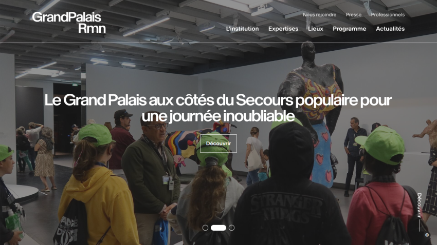 Grand Palais Rmn website hero with people in yellow jackets and headline about a memorable day with Secours populaire