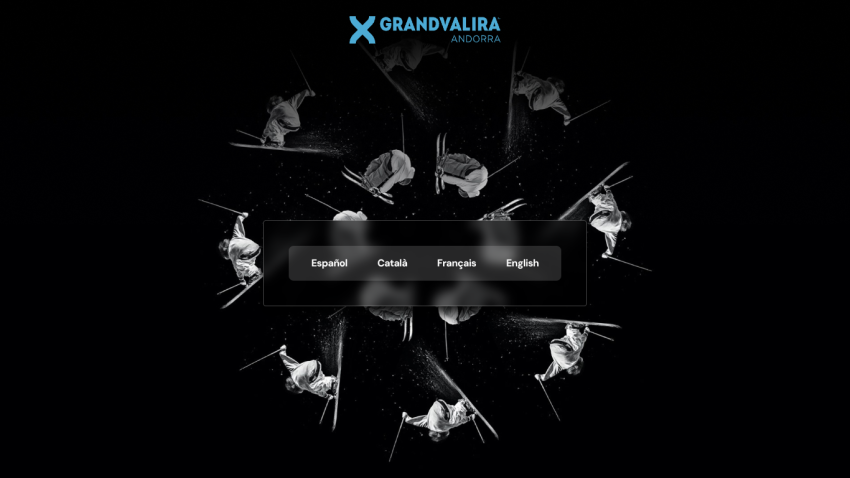 Grandvalira ski resort homepage with language options and skier images on black background
