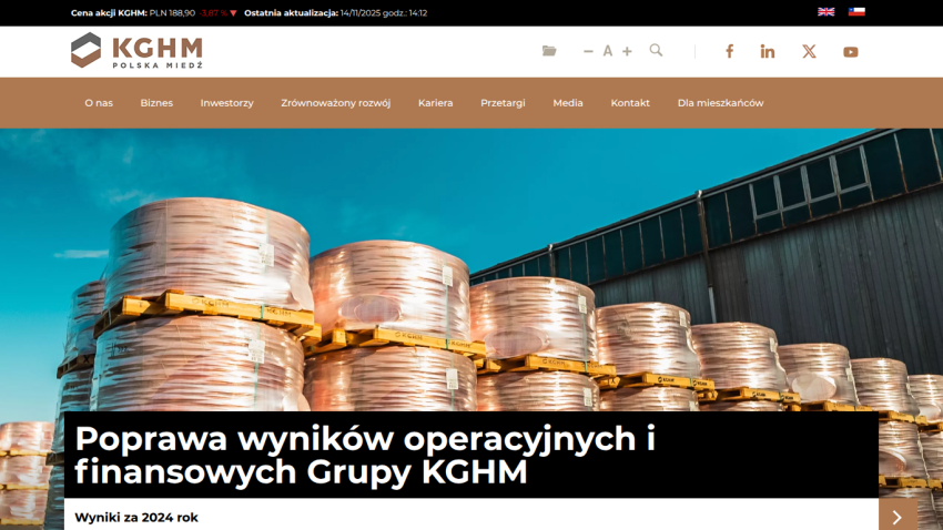 KGHM website homepage with large industrial copper stacks and headline about improving operational and financial results
