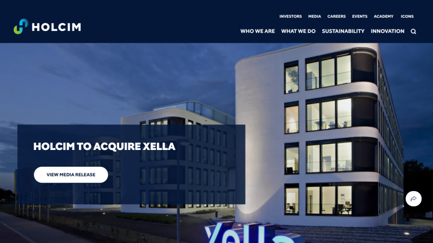 Holcim announces acquisition of Xella with a media release button on a modern office building background
