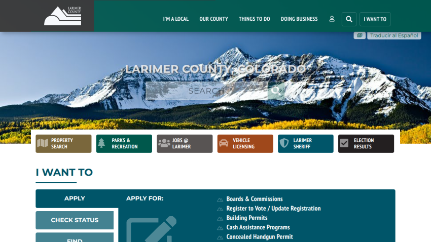 Larimer County Colorado website with mountain hero image, search bar, navigation menu, and quick links for property, parks, jobs, vehicle licensing, sheriff, and election results