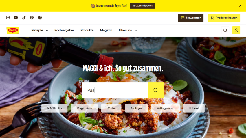 Maggi website with navigation, search bar, and a hero image of a bowl of food with sauce being poured, featuring text 'MAGGI & ich. So gut zusammen.'