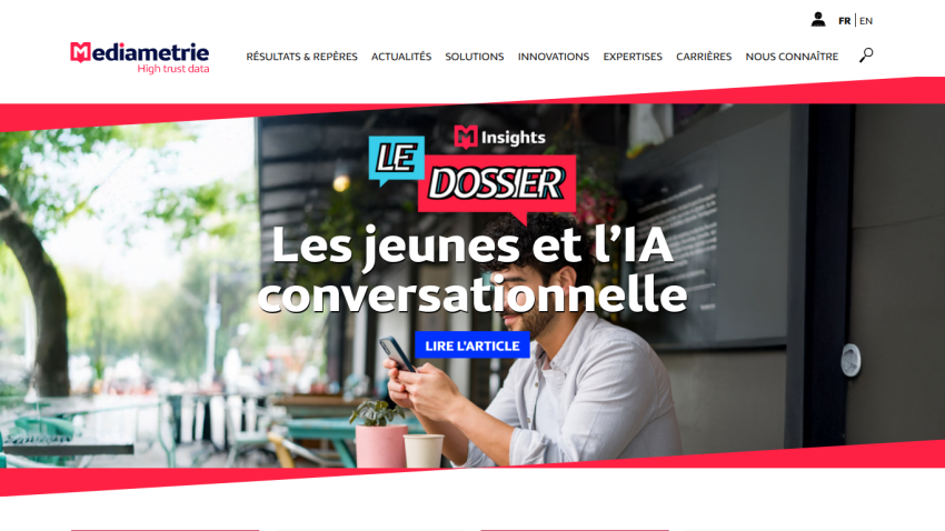 Homepage banner featuring a man working on a laptop with headline about youth and conversational AI