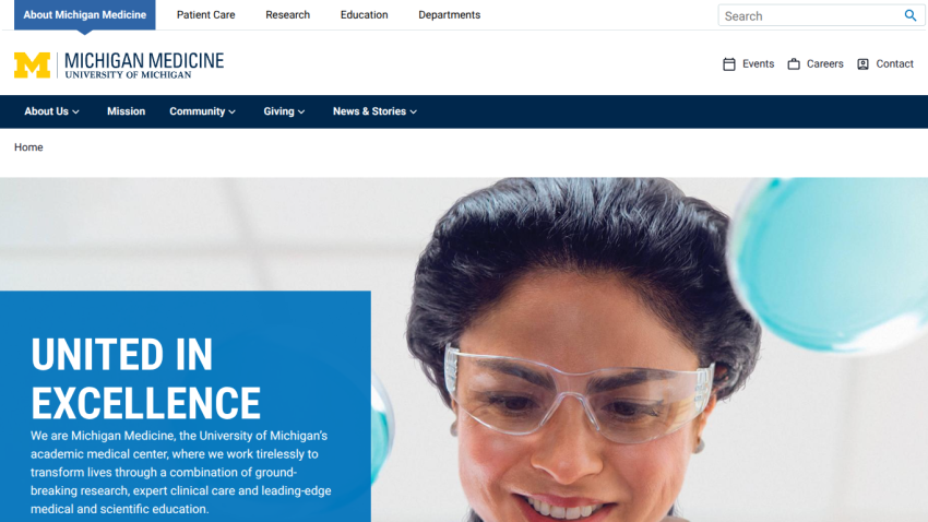 Michigan Medicine homepage featuring a healthcare professional and the slogan 'United in Excellence'.