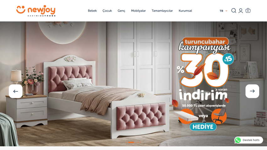 Furniture store homepage with a pink tufted bed and a promotion for up to 30% discount and gifts on purchases over 50,000 TL