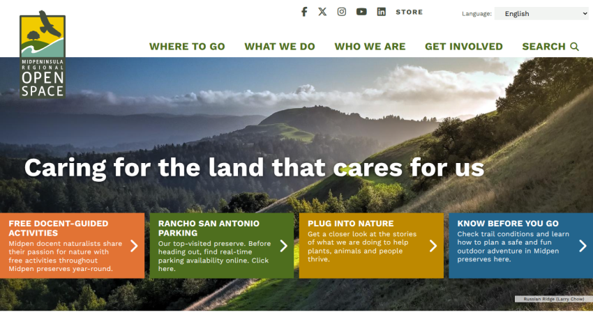 Website header with navigation and hero section showing mountains and text about caring for the land