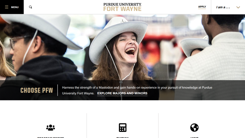 Purdue University Fort Wayne website hero section with smiling students and navigation menu