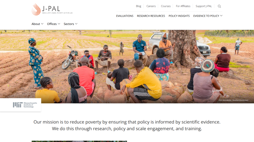J-PAL website showcasing a group discussion in a field, emphasizing their mission to reduce poverty through evidence-based policy.