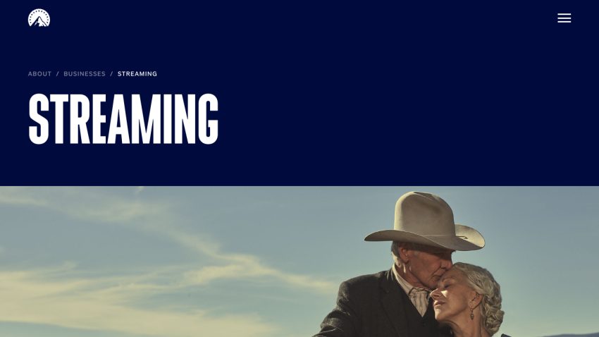 Streaming section with large text and a couple embracing against a scenic background.