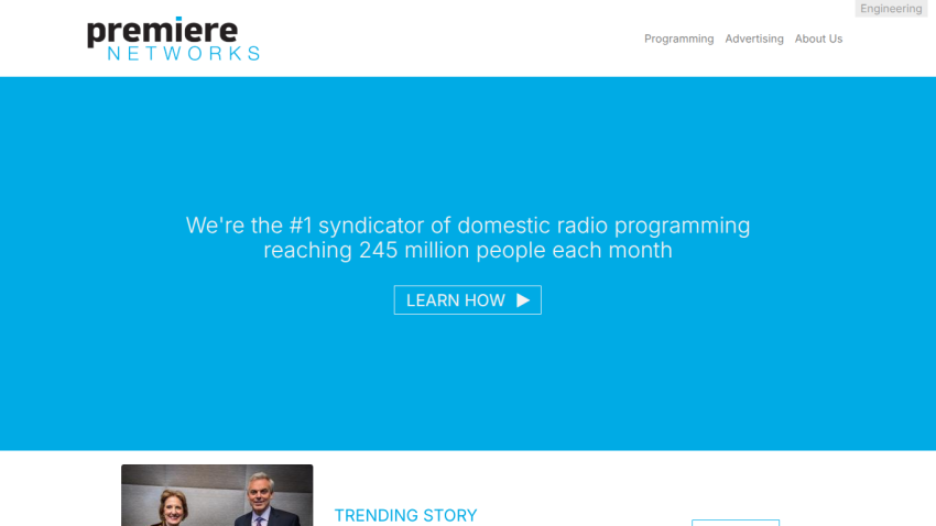 Premiere Networks homepage with headline about domestic radio programming reaching 245 million monthly listeners and a Learn How button