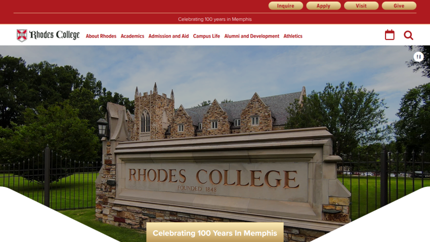 Rhodes College entrance sign with campus buildings in the background.