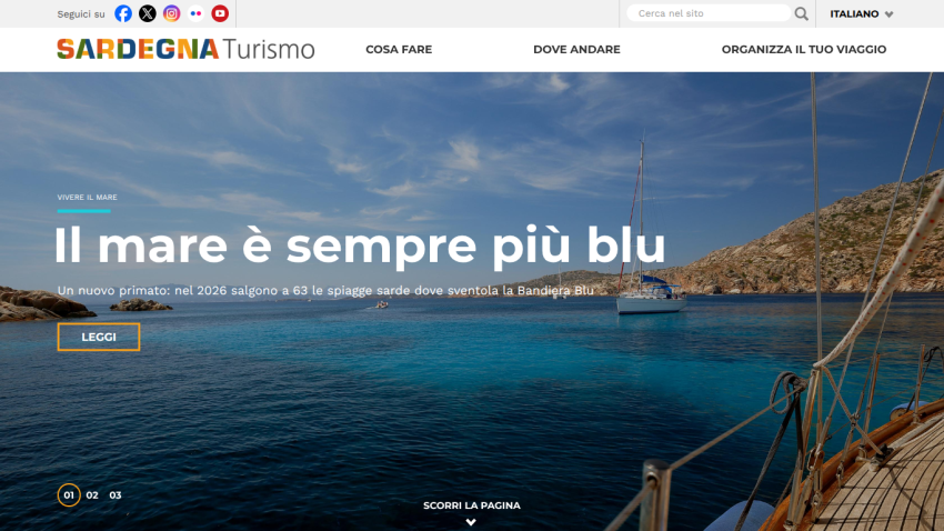Homepage of Sardegna Turismo featuring a scenic view and the text 'Il mare è sempre più blu'.