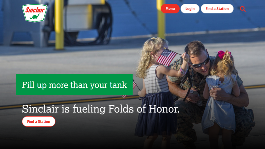 Sinclair homepage hero with a soldier hugging two children holding American flags and text about fueling Folds of Honor