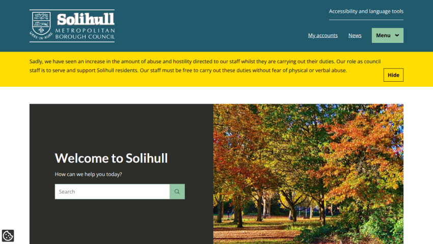 Solihull Metropolitan Borough Council homepage with search bar and autumn park image