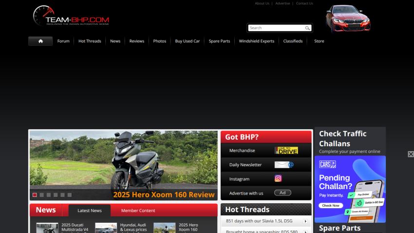 Motorcycle review section with featured articles and navigation links.