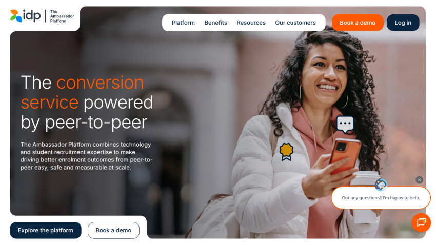 Homepage of The Ambassador Platform showing a smiling woman holding a phone and coffee, with text about peer-to-peer conversion service