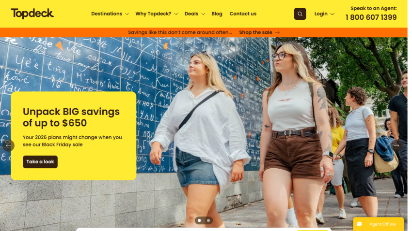 Topdeck travel site header with navigation, Black Friday sale offer up to $650 savings, and people walking outdoors.