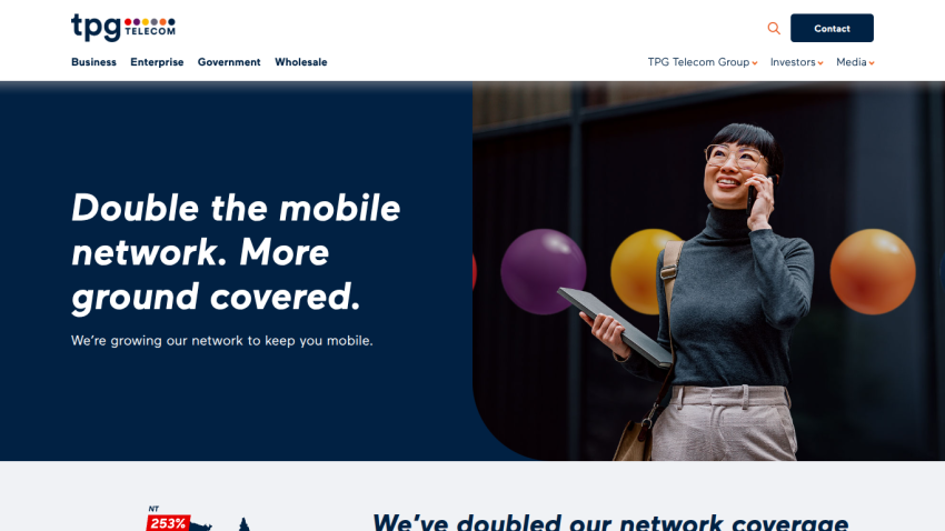 Promotional message about expanding mobile network coverage with a smiling woman holding a tablet.