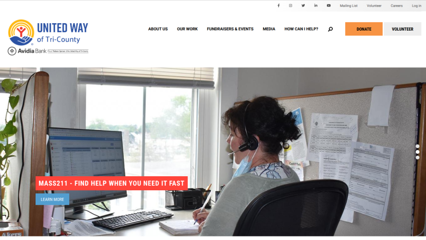 Homepage with a blue header featuring navigation links and a hero section showcasing a laptop and smartphone with app interface