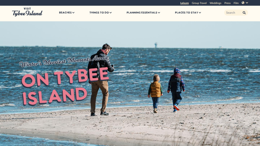 Visit Tybee Island website with navigation and hero image of a man and two children walking on the beach