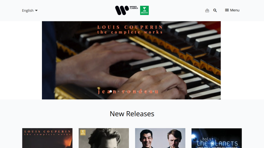 Warner Classics website header with language selector and new classical music releases including Louis Couperin and Holst albums