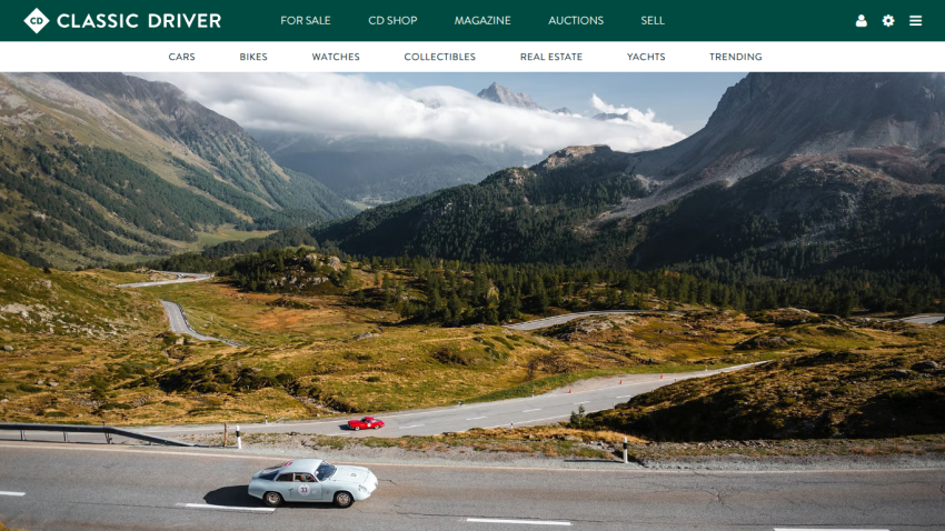 Classic Driver website showcasing a scenic mountain road with a red car and navigation options.