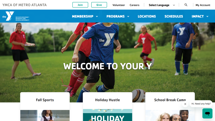 YMCA of Metro Atlanta homepage with navigation and hero image showing children playing soccer and text 'Welcome to Your Y'