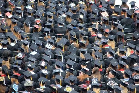 A see of college graduates at the commencement ceremony.