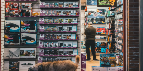 a person looking at racks in a shop