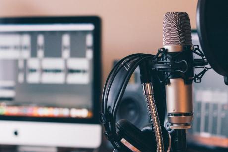 Black and silver headphones on black and silver microphone