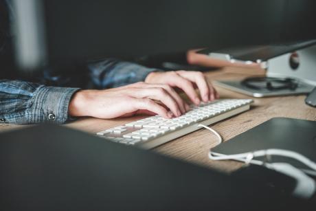 A person using computer keyboard