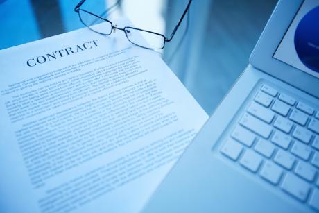  business document and laptop on the desk