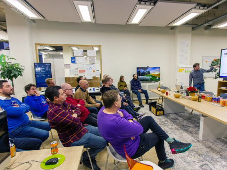 a group of people listening to a session