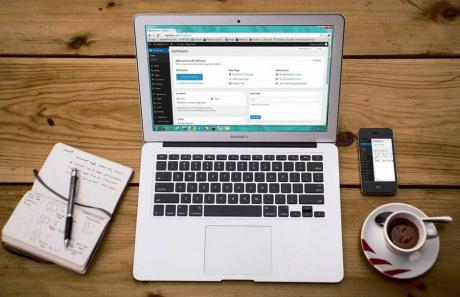 laptop on wooden table