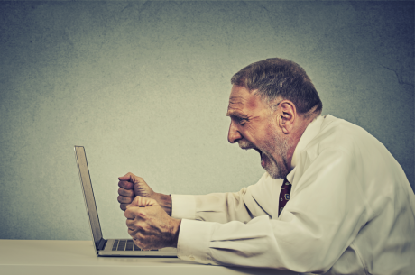 man screaming at the laptop