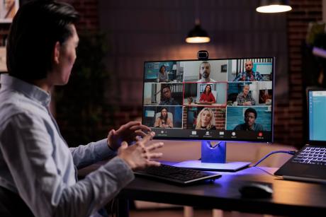 office worker using videocall conference to meet with business people on webcam